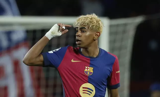 Barcelona's Lamine Yamal celebrates after scoring his side's opening goal during the Champions League semifinal first leg soccer match between Barcelona and Inter Milan at the Lluis Companys Olympic Stadium in Barcelona, Spain, Wednesday, April 30, 2025. (AP Photo/Joan Monfort)