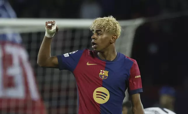 Barcelona's Lamine Yamal celebrates after scoring his side's opening goal during the Champions League semifinal first leg soccer match between Barcelona and Inter Milan at the Lluis Companys Olympic Stadium in Barcelona, Spain, Wednesday, April 30, 2025. (AP Photo/Joan Monfort)