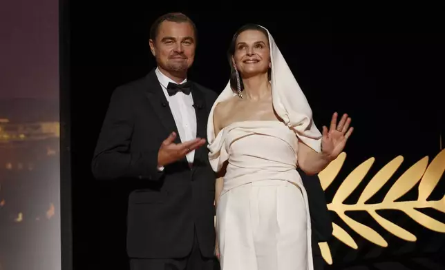 Leonardo DiCaprio, left, and jury president Juliette Binoche pose for photographers during the opening ceremony of the 78th international film festival, Cannes, southern France, Tuesday, May 13, 2025. (Photo by Joel C Ryan/Invision/AP)