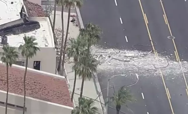 Debris covers the ground after an explosion on Saturday, May 17, 2025 in Palm Springs, Calif. (ABC7 Los Angeles via AP)