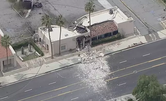 Debris covers the ground after an explosion on Saturday, May 17, 2025 in Palm Springs, Calif. (ABC7 Los Angeles via AP)