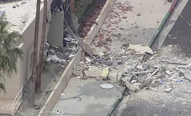 Debris covers the ground after an explosion on Saturday, May 17, 2025 in Palm Springs, Calif. (ABC7 Los Angeles via AP)