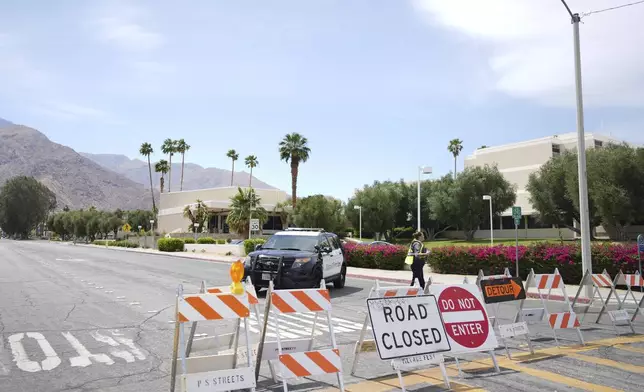 A road is closed near the site of an explosion Saturday, May 17, 2025, in Palm Springs, Calif. (AP Photo/Eric Thayer)