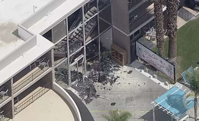 Debris covers the ground near the site of an explosion on Saturday, May 17, 2025 in Palm Springs, Calif. (ABC7 Los Angeles via AP)