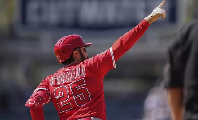 Los Angeles Angels' Travis d'Arnaud gestures after hitting a solo home run during the eighth inning of a baseball game against the Los Angeles Dodgers, Sunday, May 18, 2025, in Los Angeles. (AP Photo/Mark J. Terrill)