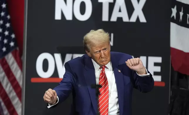 FILE - Republican presidential nominee former President Donald Trump dances at a campaign event at the Cobb Energy Performing Arts Centre, Oct. 15, 2024, in Atlanta. (AP Photo/John Bazemore, File)