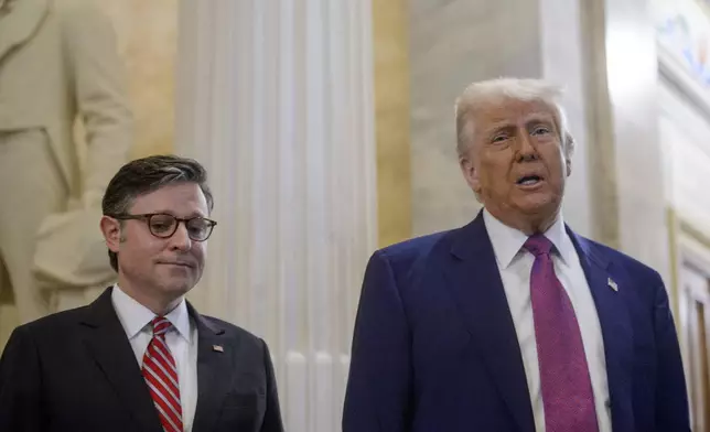 President Donald Trump, right, is joined by Speaker of the House Mike Johnson, R-La., as he arrives for a meeting with the House Republican Conference at the Capitol, Tuesday, May 20, 2025, in Washington. (AP Photo/Rod Lamkey, Jr.)
