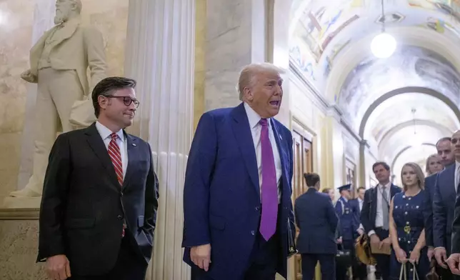 President Donald Trump, right, is joined by Speaker of the House Mike Johnson, R-La., as he arrives for a meeting with the House Republican Conference at the Capitol, Tuesday, May 20, 2025, in Washington. (AP Photo/Rod Lamkey, Jr.)