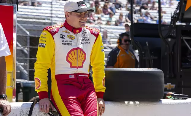 Josef Newgarden waits for the start of practice for the Indianapolis 500 auto race at Indianapolis Motor Speedway in Indianapolis, Sunday, May 18, 2025. (AP Photo/Michael Conroy)