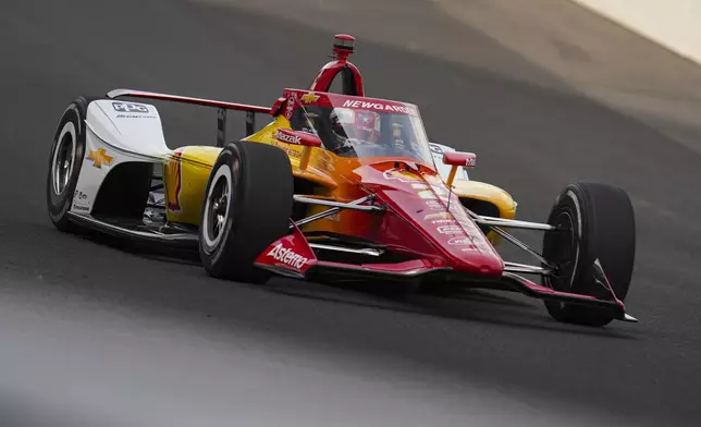 Josef Newgarden drives through the first turn during practice for the Indianapolis 500 auto race at Indianapolis Motor Speedway in Indianapolis, Thursday, May 15, 2025. (AP Photo/Michael Conroy)