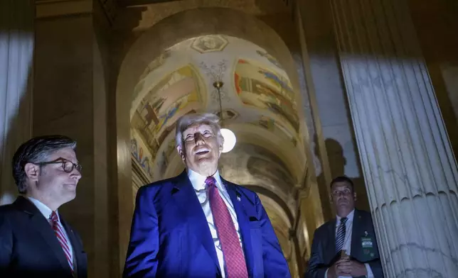 President Donald Trump, right, is joined by Speaker of the House Mike Johnson, R-La., left, as he speaks with reporters upon his departure from the Capitol following a meeting with the House Republican Conference, Tuesday, May 20, 2025, in Washington. (AP Photo/Rod Lamkey, Jr.)