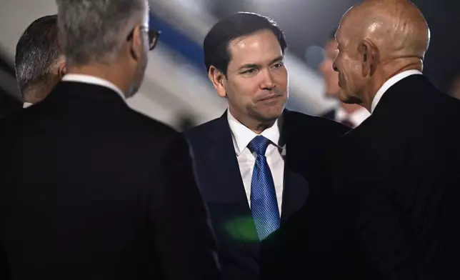 U.S. Embassy and Turkey officials greet Secretary of State Marco Rubio as he arrives, Wednesday, May 14, 2025 in Antalya, Turkey, to attend an informal meeting of NATO Ministers of Foreign Affairs. (Ozan Kose/Pool via AP)