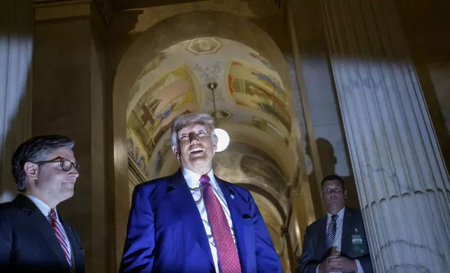 President Donald Trump, right, is joined by Speaker of the House Mike Johnson, R-La., left, as he speaks with reporters upon his departure from the Capitol following a meeting with the House Republican Conference, Tuesday, May 20, 2025, in Washington. (AP Photo/Rod Lamkey, Jr.)