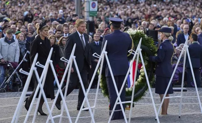 Dutch King Willem-Alexander and Queen Maxima lay a wreath during a solemn annual national service to commemorate the war dead in Amsterdam, Netherlands, Sunday, May 4, 2025. (AP Photo/Peter Dejong)