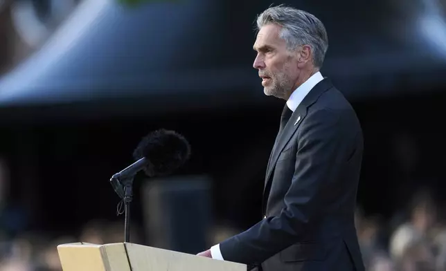 Netherlands' Prime Minister Dick Schoof speaks prior to laying a wreath during a solemn annual national service to commemorate the war dead in Amsterdam, Netherlands, Sunday, May 4, 2025. (AP Photo/Peter Dejong)