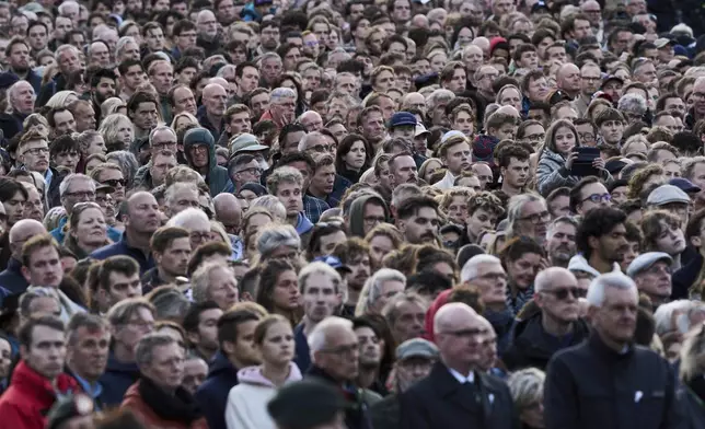 People attend a solemn annual national service to commemorate the war dead in Amsterdam, Netherlands, Sunday, May 4, 2025. (AP Photo/Peter Dejong)