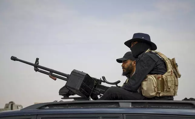Syria's security forces are deployed at a highway where they found bodies of Syrian Druze fighters who were in a convoy heading from the southern Sweida province towards the capital, at al-Sor al-Kobra village near the Sweida town, southern Syria, Thursday, May 1, 2025. (AP Photo/Omar Albam)