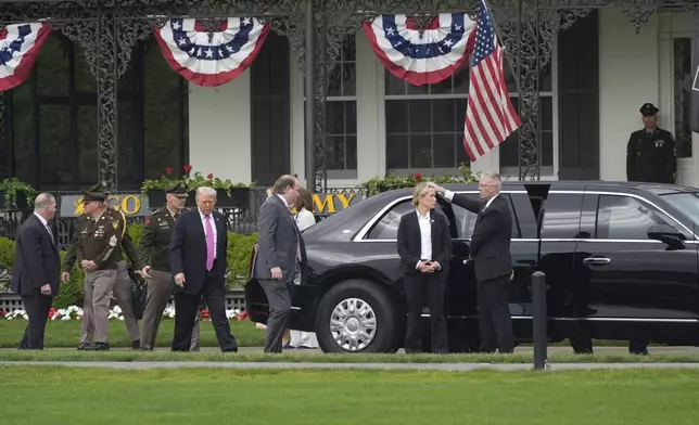 President Donald Trump, fourth from left, walks to board his motorcade before delivering the commencement speech at the United States Military Academy commencement ceremonies in West Point, N.Y., Saturday, May 24, 2025. (AP Photo/Manuel Balce Ceneta)