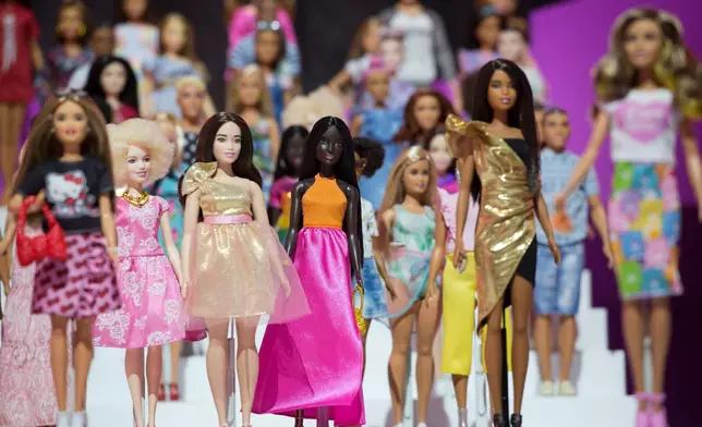 FILE- In this Feb. 20, 2018, file photo dozens of Barbie dolls are displayed at the Mattel showroom at Toy Fair in New York. Mattel reports earnings Thursday, April 26. (AP Photo/Mark Lennihan, File)