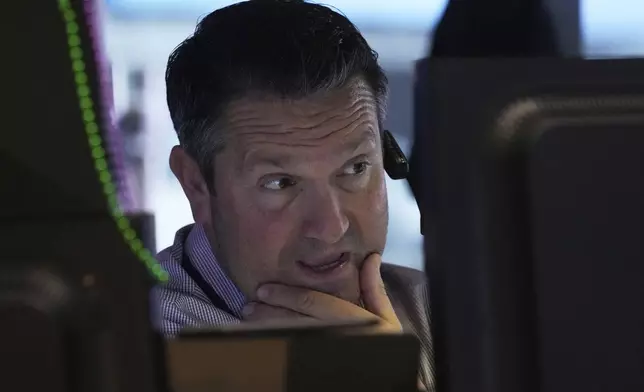 Trader Leon Montana works on the floor of the New York Stock Exchange, Thursday, May 1, 2025. (AP Photo/Richard Drew)