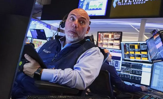 Trader Vincent Napolitano works on the floor of the New York Stock Exchange, Thursday, May 1, 2025. (AP Photo/Richard Drew)