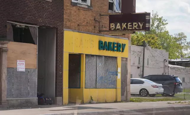 A shuttered bakery is seen near the Pace Harvey Transportation Center, Thursday, May 29, 2025, in Harvey, Ill. (AP Photo/Erin Hooley)
