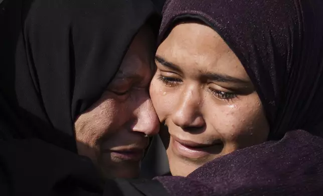 Palestinian women mourn their relatives killed in an Israeli army strike in Khan Younis, Gaza Strip, Saturday, May 3, 2025. (AP Photo/Abdel Kareem Hana)