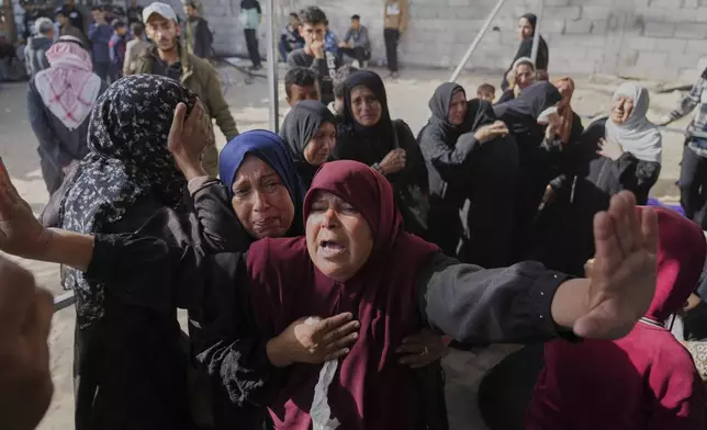 Palestinian women mourn their relatives killed in an Israeli army strike in Khan Younis, Gaza Strip, Saturday, May 3, 2025. (AP Photo/Abdel Kareem Hana)