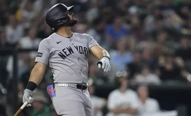 New York Yankees' Jasson Domínguez watches his sacrifice fly during the fifth inning of a baseball game against the Athletics, Friday, May 9, 2025, in West Sacramento, Calif. (AP Photo/Godofredo A. Vásquez)