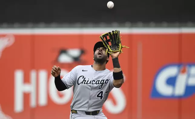 Chicago White Sox right fielder Joshua Palacios prepares to catch a fly ball in foul territory hit by Baltimore Orioles' Ramon Urias for the out during the second inning of a baseball game, Friday, May 30, 2025, in Baltimore. (AP Photo/Nick Wass)