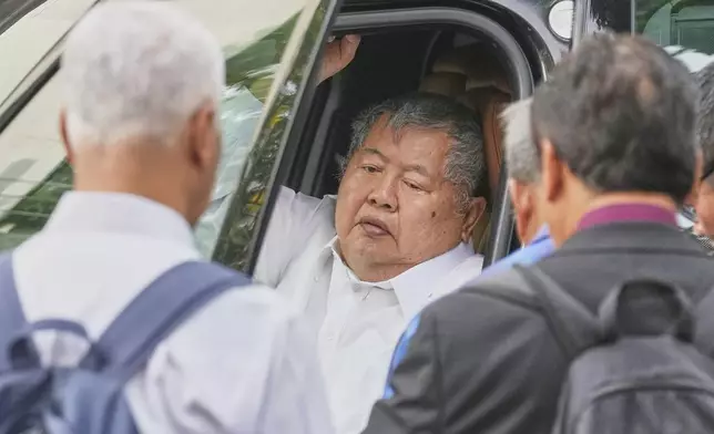 Premchai Karnasuta, the president of Italian-Thai Development Co arrives at Bang Sue Police Station in Bangkok, Thailand, Friday, May 16, 2025 to surrender to police on criminal negligence charges for the collapse of a Bangkok high-rise during a March 28 earthquake. (AP Photo/Sakchai Lalit)