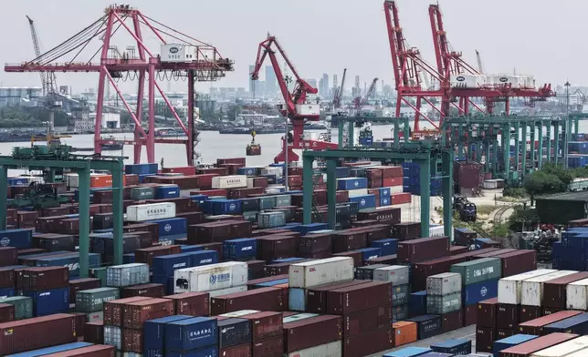 Machines loading container at a container terminal, in Shanghai, China on Wednesday, May 14, 2025. (Chinatopix Via AP)
