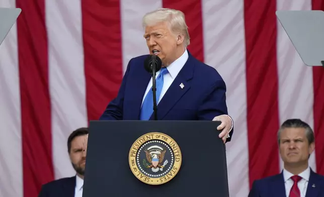 President Donald Trump delivers the Memorial Day Address at the 157th National Memorial Day Observance at Arlington National Cemetery, Monday, May 26, 2025, in Arlington, Va., as Vice President JD Vance and Secretary of Defense Pete Hegseth, right, look on. (AP Photo/Julia Demaree Nikhinson)