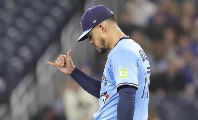 Toronto Blue Jays pitcher Jose Berrios gestures after striking out Boston Red Sox's Rafael Devers during first-inning baseball game action in Toronto, Thursday, May 1, 2025. (Chris Young/The Canadian Press via AP)