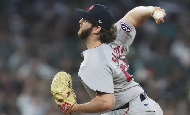 Boston Red Sox pitcher Justin Slaten throws against the Detroit Tigers in the eighth inning during a baseball game, Wednesday, May 14, 2025, in Detroit. (AP Photo/Paul Sancya)