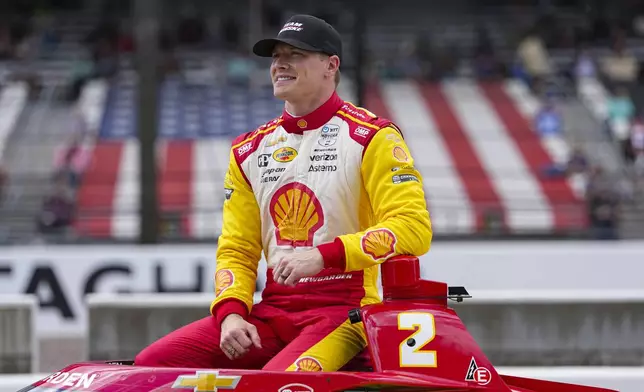 Josef Newgarden poses for a photo after he qualified for the Indianapolis 500 auto race at Indianapolis Motor Speedway in Indianapolis, Saturday, May 17, 2025. (AP Photo/Michael Conroy)