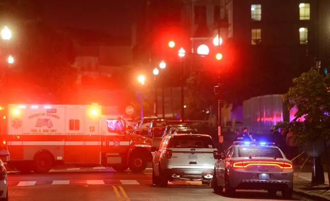 Law enforcement work the scene after two staff members of the Israeli Embassy in Washington were shot and killed outside the Capital Jewish Museum, Thursday, May 22, 2025, in Washington. (AP Photo/Rod Lamkey, Jr.)