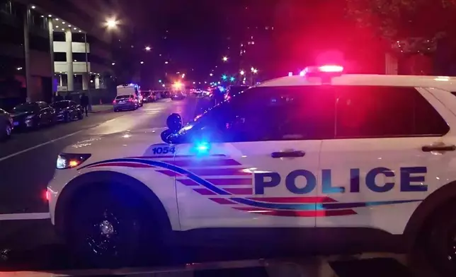In this image taken from video provided by WJLA, law enforcement work the scene after two staff members of the Israeli embassy in Washington were shot and killed outside the Capital Jewish Museum on Wednesday, May 21, 2025, in Washington. (WJLA via AP)