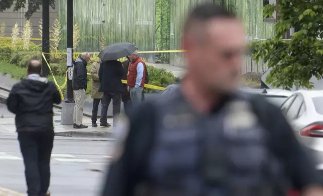 Law enforcement work the scene after two staff members of the Israeli Embassy in Washington were shot and killed outside the Capital Jewish Museum, Thursday, May 22, 2025, in Washington. (AP Photo/Rod Lamkey, Jr.)