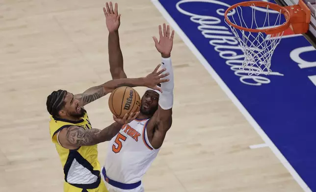 Indiana Pacers forward Obi Toppin (1) goes up for a shot against New York Knicks forward Precious Achiuwa (5) during the third quarter of Game 5 of the NBA basketball Eastern Conference finals, Thursday, May 29, 2025, in New York. (AP Photo/Adam Hunger)