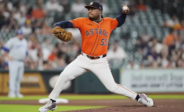 Houston Astros relief pitcher Framber Valdez throws during the first inning of a baseball game against the Kansas City Royals in Houston, Tuesday, May 13, 2025. (AP Photo/Ashley Landis)