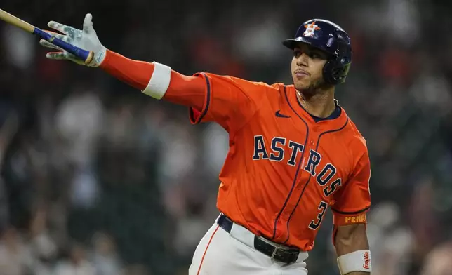 Houston Astros' Jeremy Pena drops his bat after hitting a home run during the sixth inning of a baseball game against the Kansas City Royals in Houston, Tuesday, May 13, 2025. (AP Photo/Ashley Landis)
