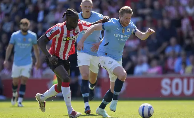 Southampton's Lesley Ugochukwu, left, and Manchester City's Kevin De Bruyne vie for the ball during their Premier League soccer match at St Mary's Stadium, Southampton, England, Saturday May 10, 2025. (Andrew Matthews/PA via AP)