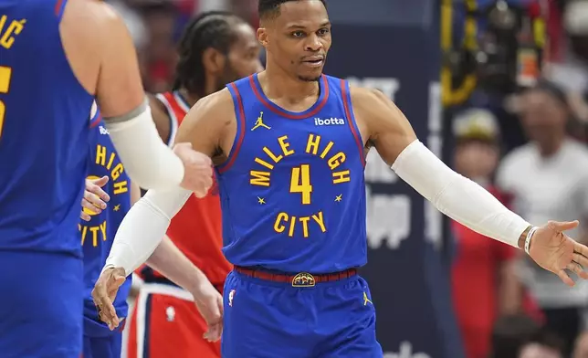Denver Nuggets guard Russell Westbrook is congratulated after drawing a foul against the Los Angeles Clippers in the second half of Game 7 of an NBA basketball first-round playoff series Saturday, May 3, 2025, in Denver. (AP Photo/David Zalubowski)
