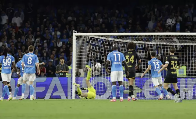Napoli's Alex Meret deflects the ball into his own net during a Serie A soccer match against Genoa at the Diego Armando Maradona Stadium in Naples, southern Italy, Sunday, May 11, 2025. (Alessandro Garofalo/LaPresse via AP)