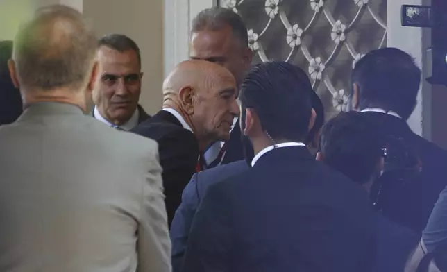 U.S. Ambassador to Turkey and Special Envoy to Syria Tom Barrack, center, arrives to inaugurate the long-shuttered U.S. ambassador's residence in Damascus, Syria, Thursday, May 29, 2025. (AP Photo/Omar Sanadiki)
