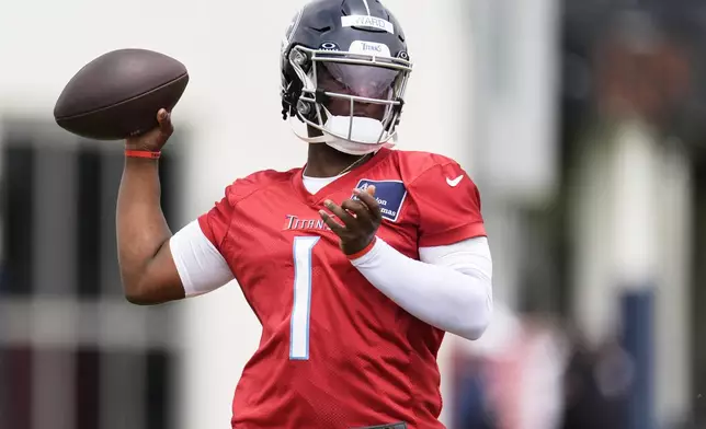 Tennessee Titans quarterback Cam Ward (1) looks to throw a pass during the NFL football team's rookie minicamp Saturday, May 10, 2025, in Nashville, Tenn. (AP Photo/George Walker IV)
