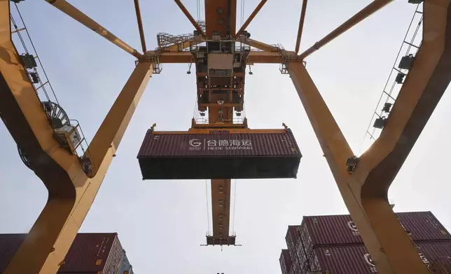 FILE - Cranes work on stacks of containers at the Bangkok Port in Bangkok, Thailand, Thursday, April 10, 2025. (AP Photo/Sakchai Lalit, File)