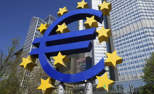FILE - A view of the European currency Euro sculpture, at Germany's main financial district in Frankfurt, Germany, Wednesday, April 9, 2025. (AP Photo/Martin Meissner, File)