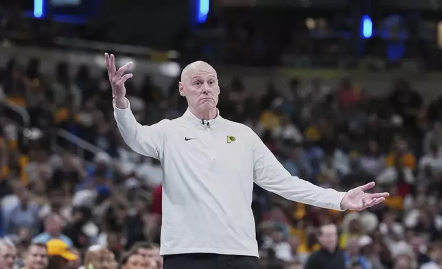 Indiana Pacers head coach Rick Carlisle calls out from the bench in the second half of Game 4 against the Cleveland Cavaliers in the Eastern Conference semifinals of the NBA basketball playoffs in Indianapolis, Sunday, May 11, 2025. (AP Photo/Michael Conroy)